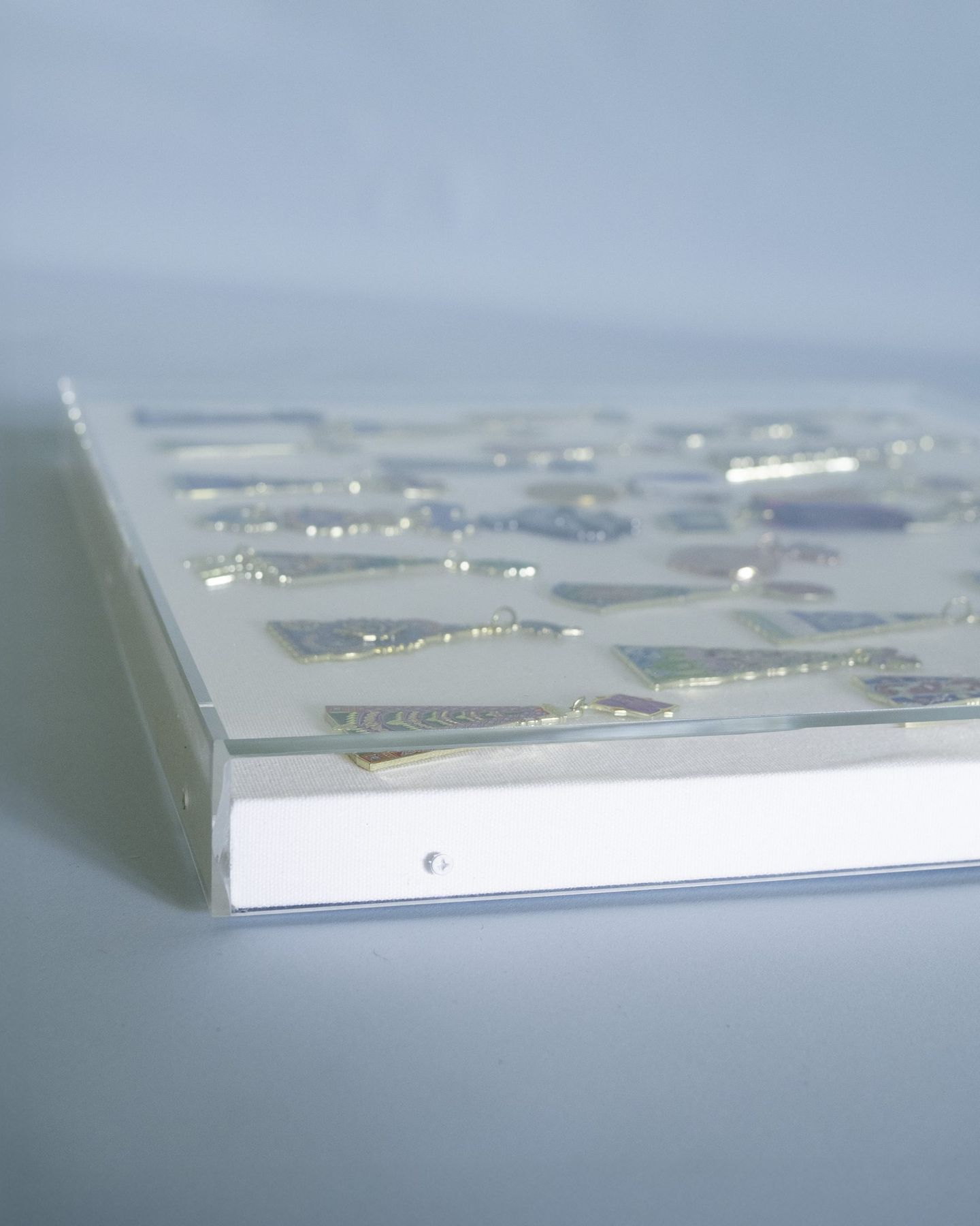 Optically bonded edge detail of a custom acrylic vitrine, SBAS Houston