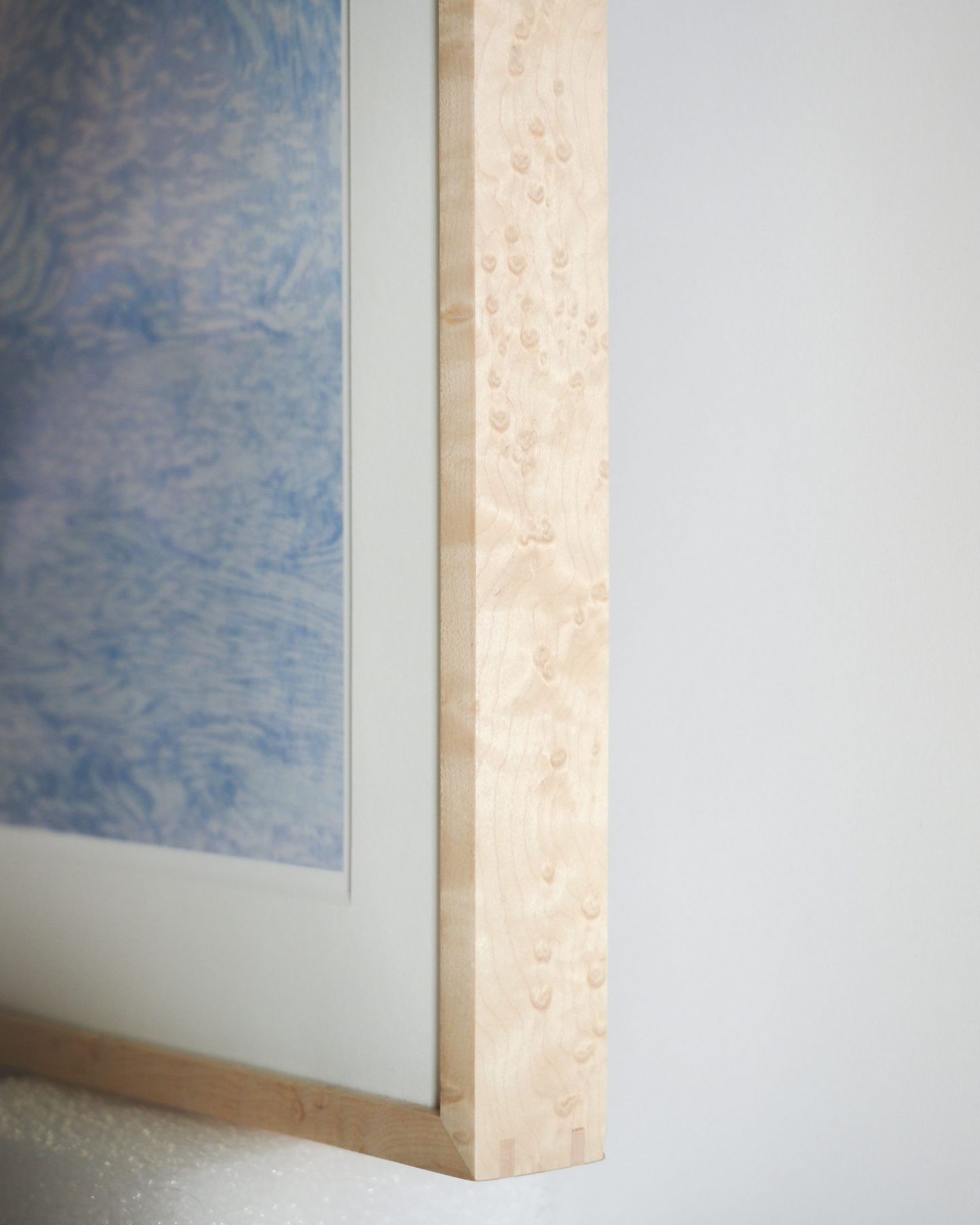 Bird's-eye maple frame edge showing figured grain, SBAS Houston