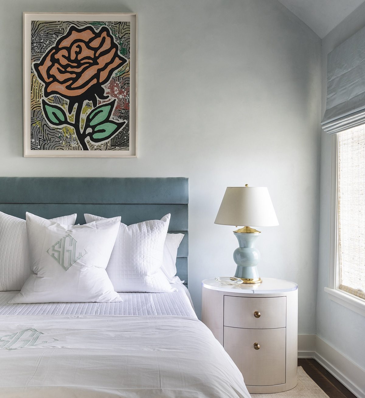 Bedroom with a framed rose artwork above the bed, a Chandos Interiors project framed by SBAS Houston