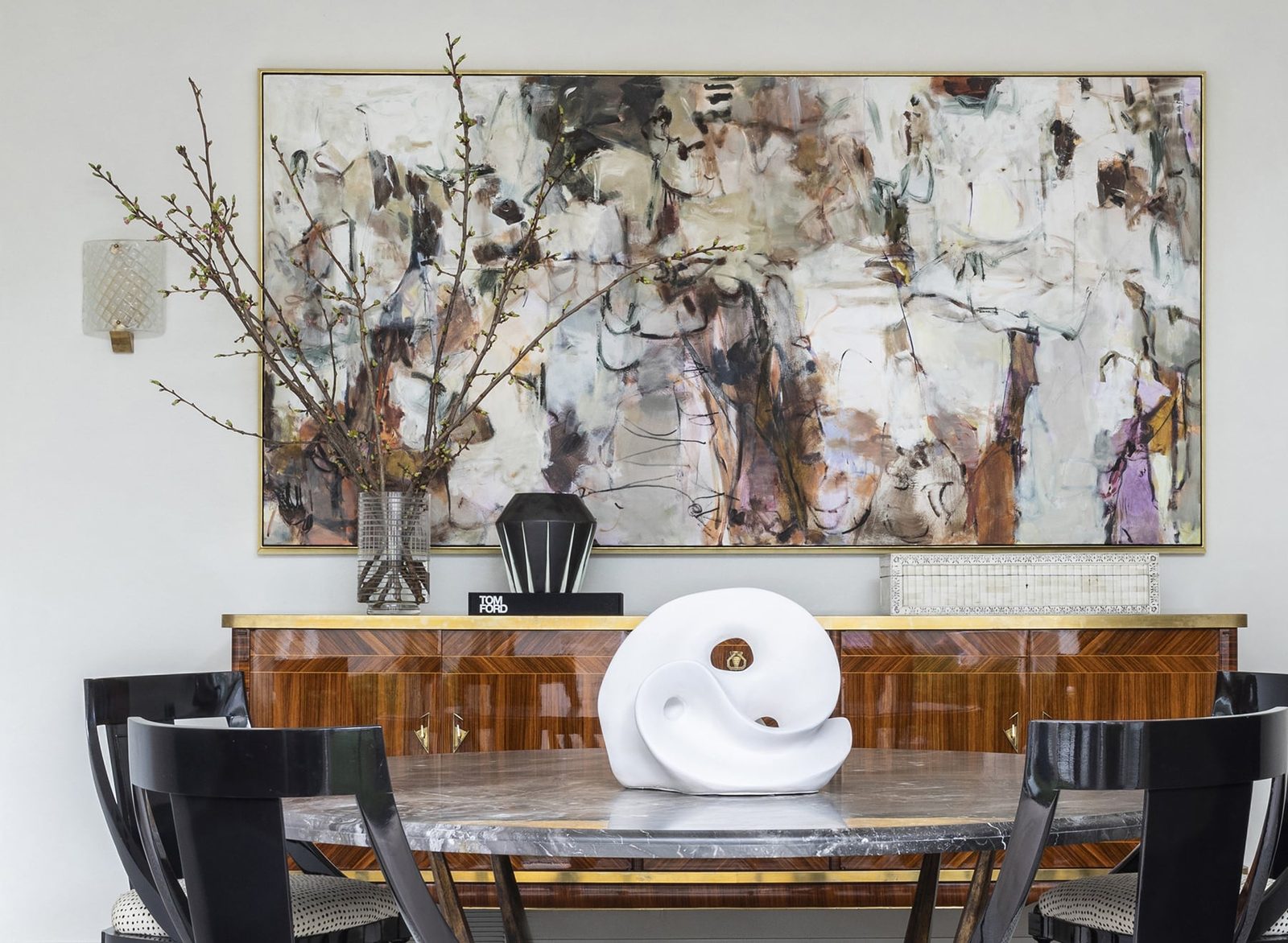 Dining room with a large framed abstract painting, a Chandos Interiors project framed by SBAS Houston