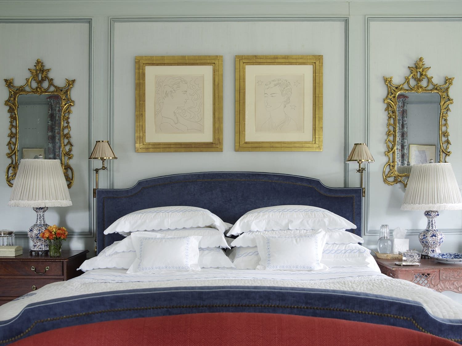 Bedroom with a pair of gilded frames above the headboard, framing by SBAS Houston