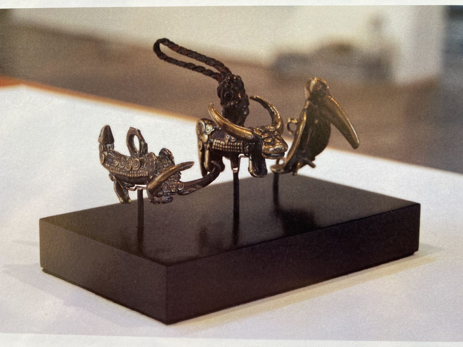 Bronze objects pinned on a custom black base, SBAS Houston