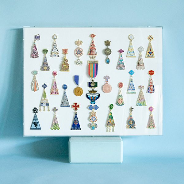 Collection of thirty Fiesta San Antonio commemorative pins in an acrylic case, SBAS Houston