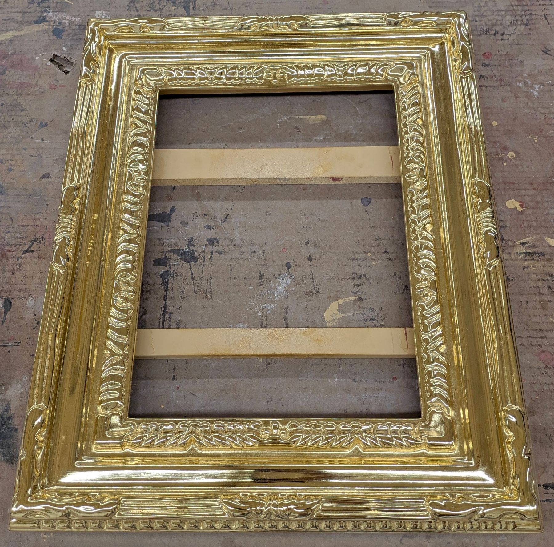 Freshly gilded hand-carved frame in the SBAS Houston gilding workshop