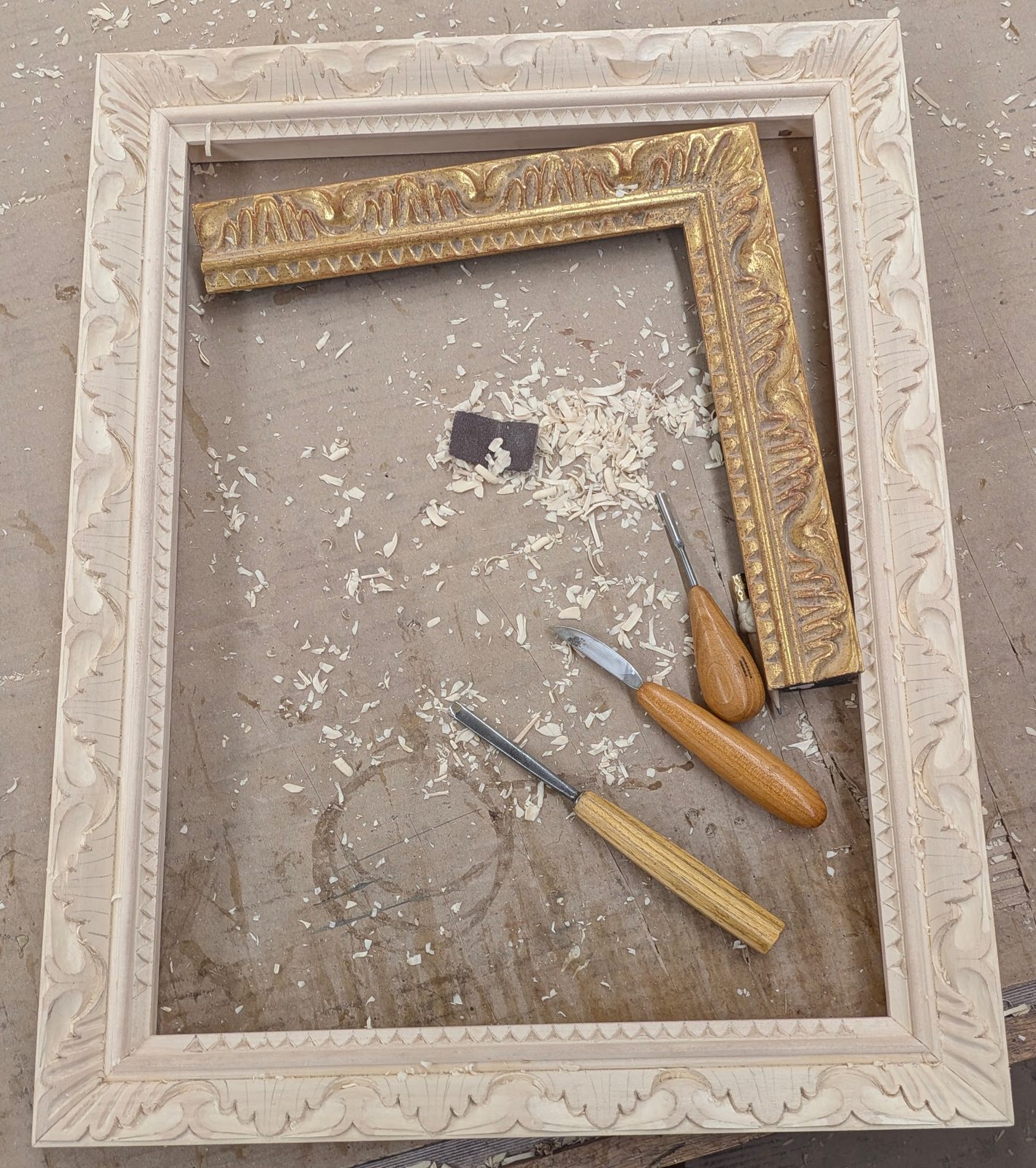 Frame carving in process on the bench, SBAS Houston