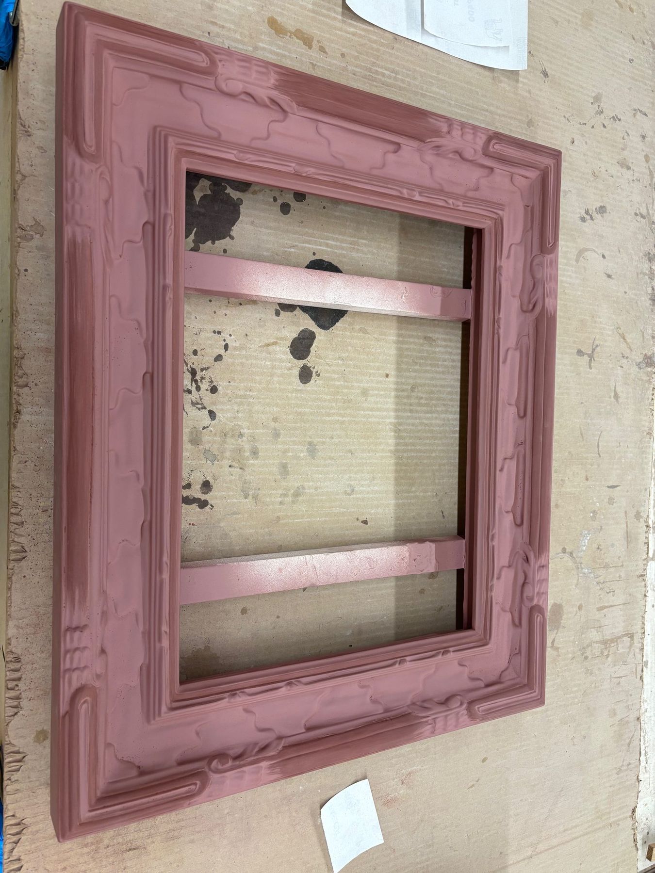 Hand-carved frame coated in red gilder's bole before water gilding, SBAS Houston studio