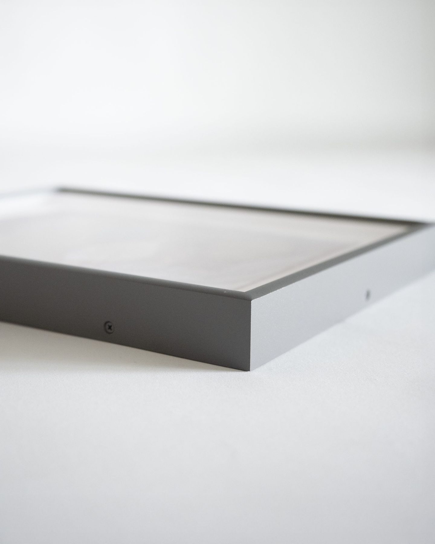 Grey powder-coated aluminum frame corner detail, SBAS Houston