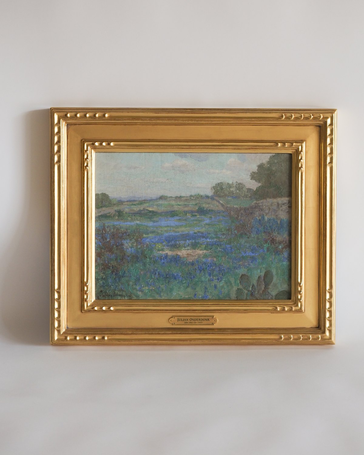 Small landscape painting in an ornamented gold leaf frame with engraved nameplate, framed by SBAS Houston