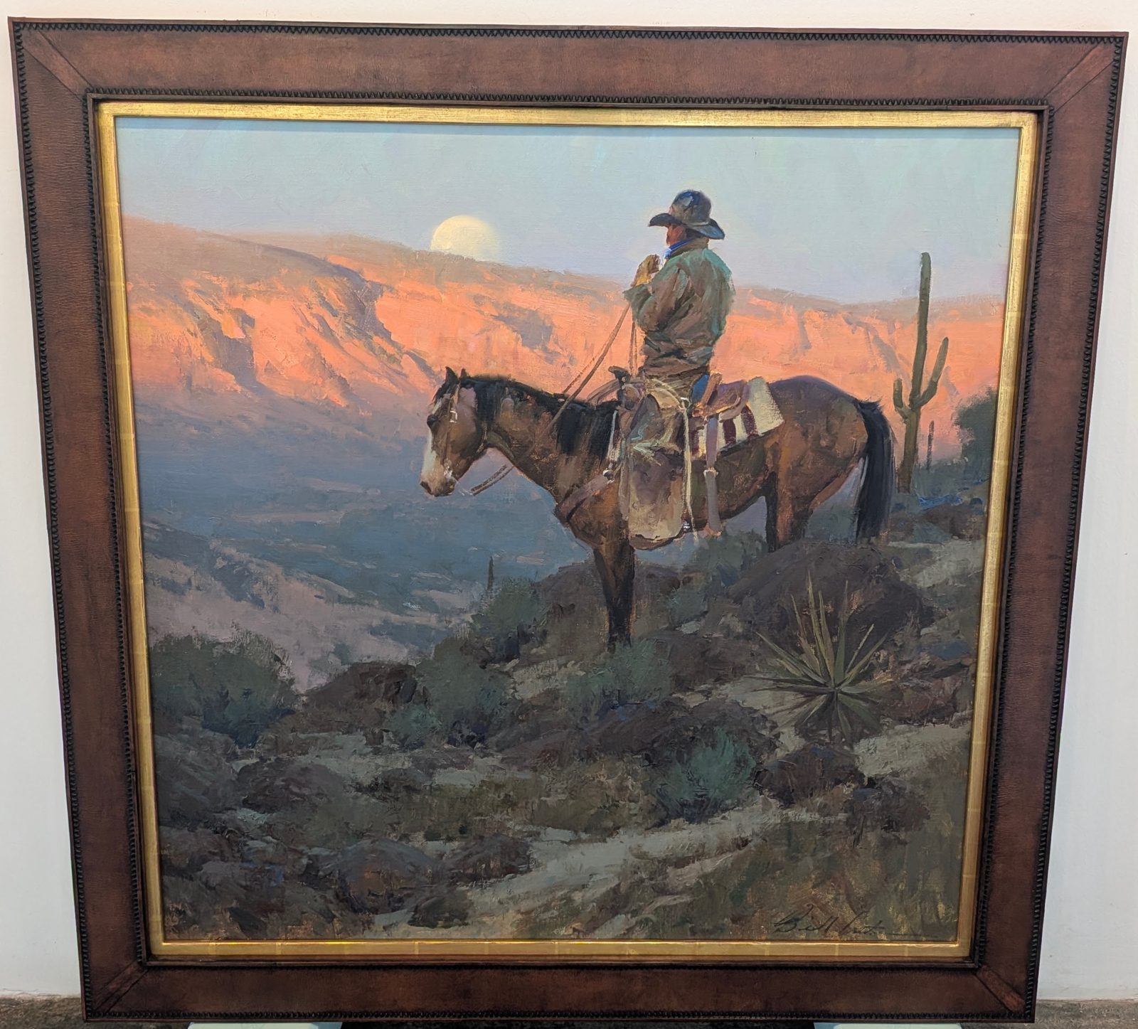 Western painting in a leather frame with a gilded inner lip, SBAS Houston