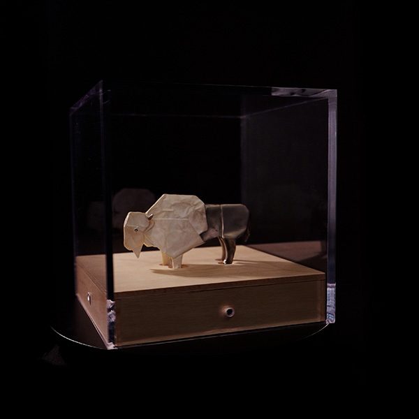 Miniature sculpture mounted on a custom wooden base under an acrylic bonnet, SBAS Houston