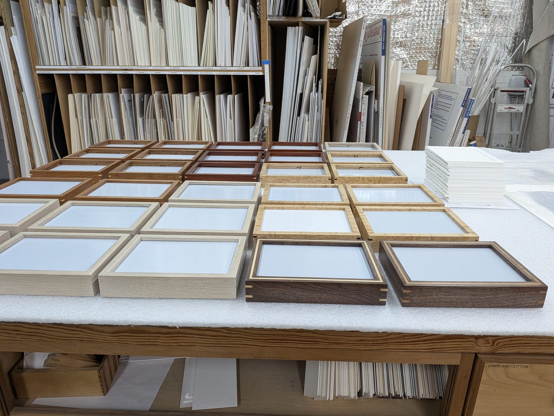 Hand-finished frames in progress on the workbench at SBAS Houston