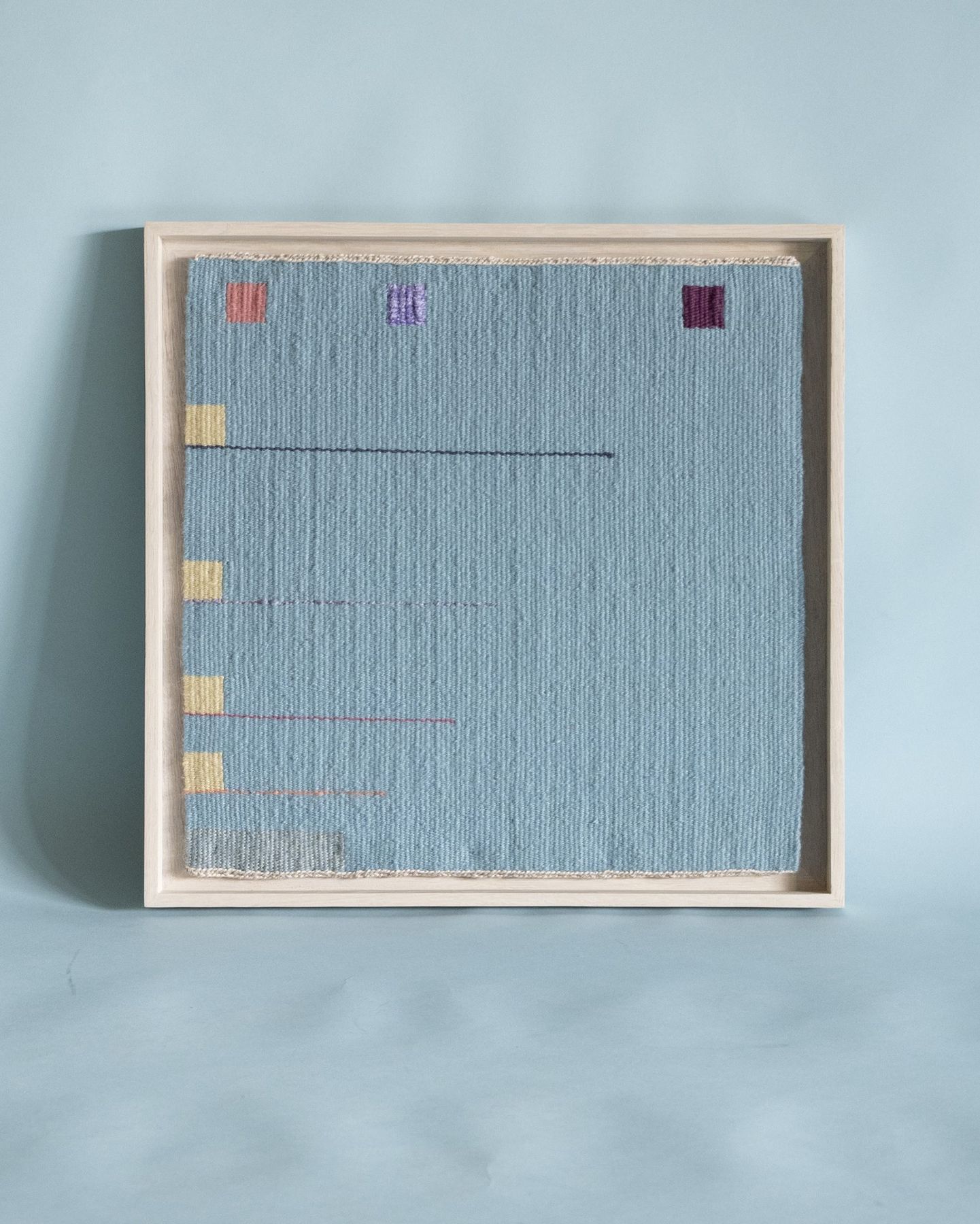 Handwoven textile in a white float frame, SBAS Houston