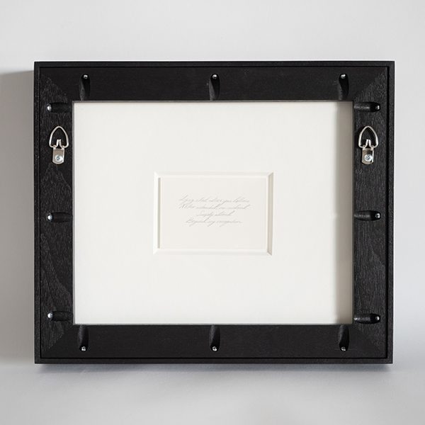 Verso window presenting a poem floated in an 8-ply mat behind the lithograph