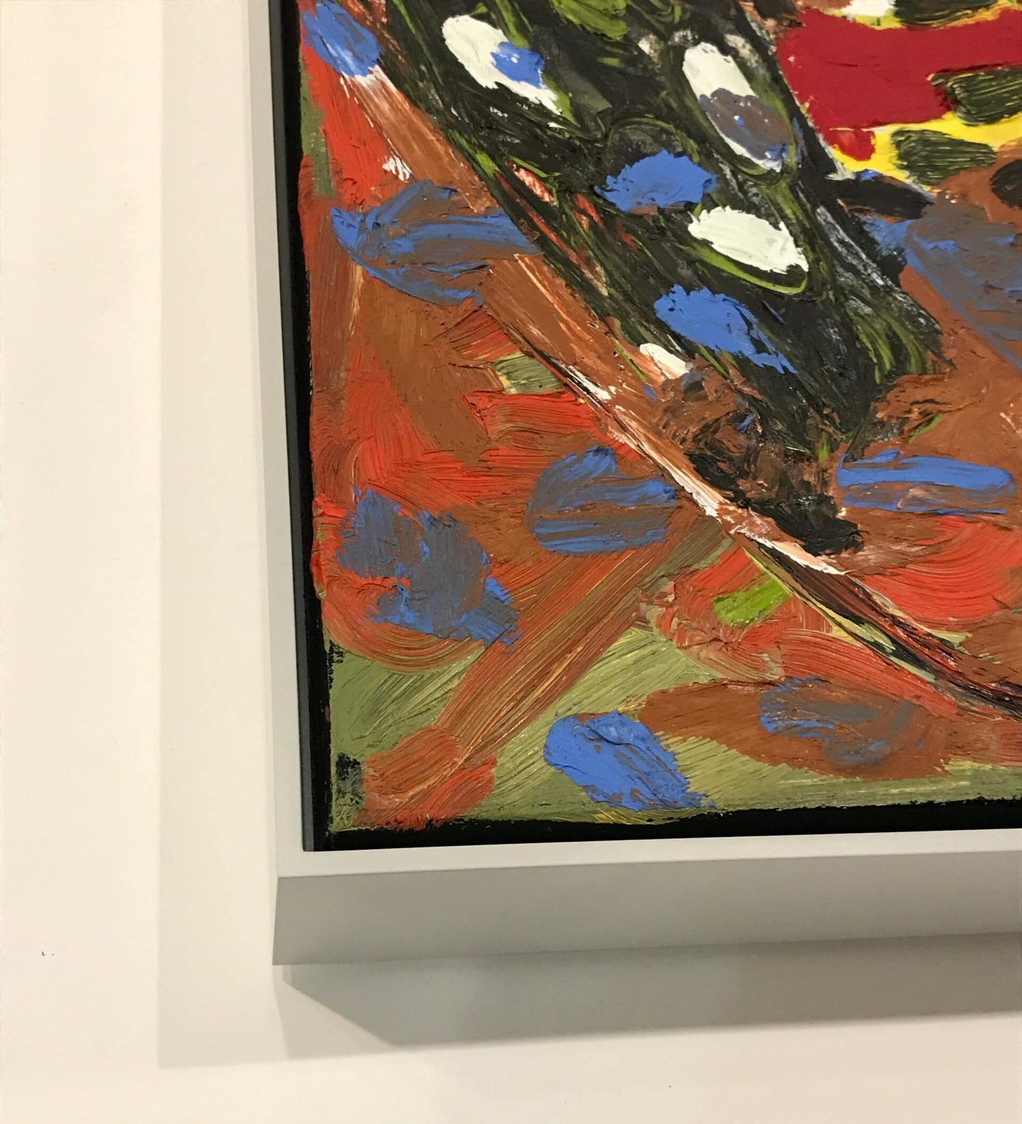 White float frame corner detail on a vivid abstract painting, SBAS Houston